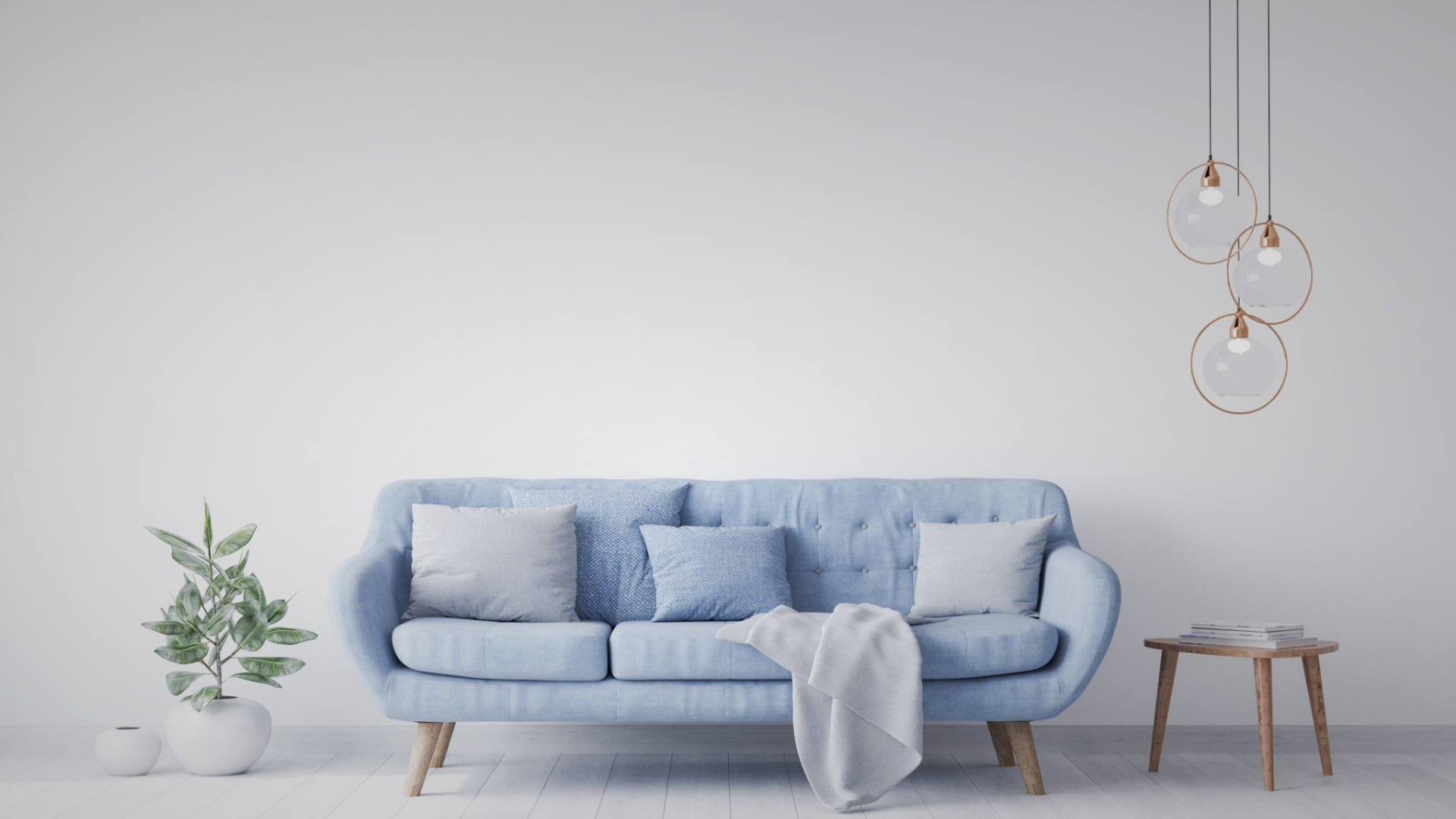 A calm, light-filled room with a soft blue couch
