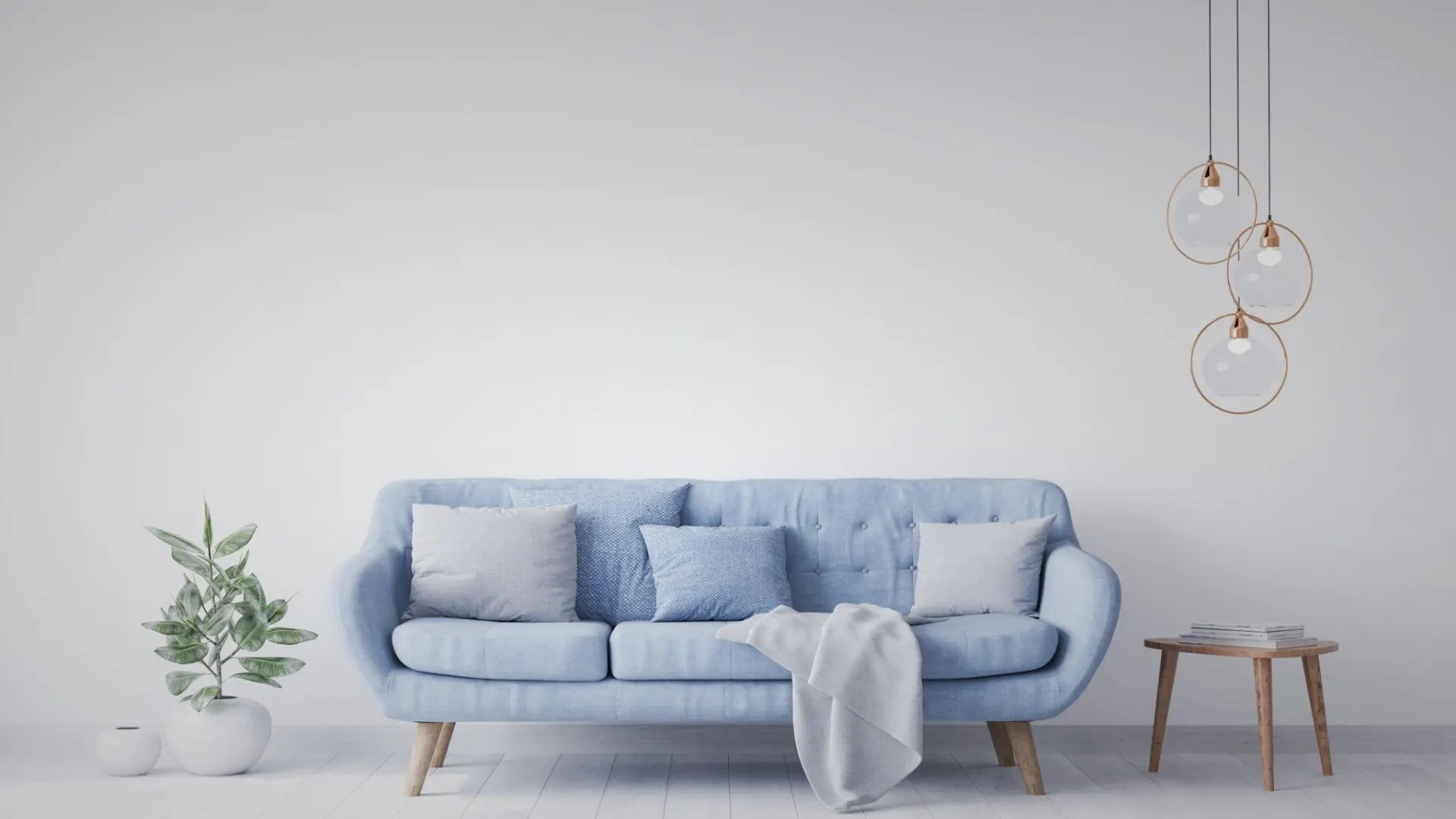 A calm, light-filled room with a soft blue couch